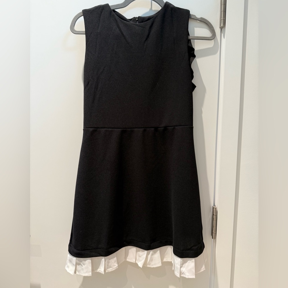 Black Sleeveless Dress with White Ruffle Hem